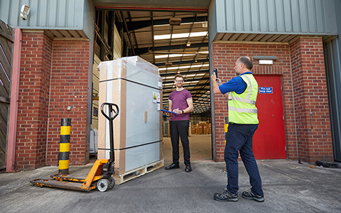 Price Express Transport Employee Taking a Photo to Track Delivery